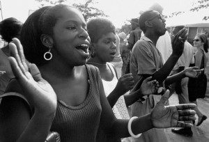 138. Marchers sing freedom songs on route to Jackson. Matt Herron Near Jackson, Mississippi, 1966