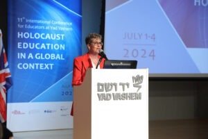 A photo of Yad Vashem's Sheryl Ochayon at a speaking engagement.